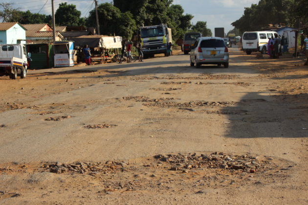 Aging tarred roads vanish amid increasing gravel-filled potholes in Zimbabwe.