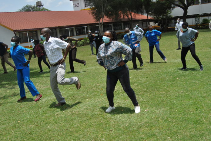 Health workers in the front line against the pandemic dance to ease their minds