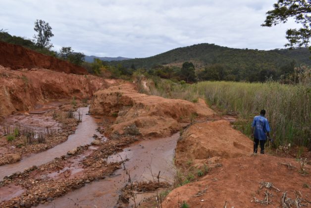 The environmental damage left by illegal miners along river beds in Zimbabwe