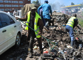 Mwangi cleaning the environment at Grogon in Nairobi