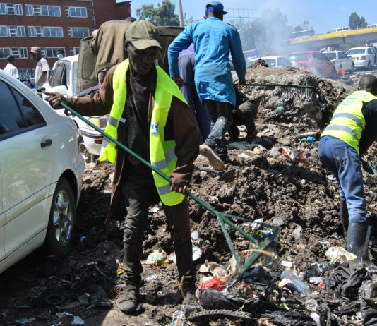 Mwangi cleaning the environment at Grogon in Nairobi