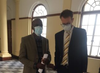 Jeffrey Moyo, left, and his lawyer Douglas Coltart