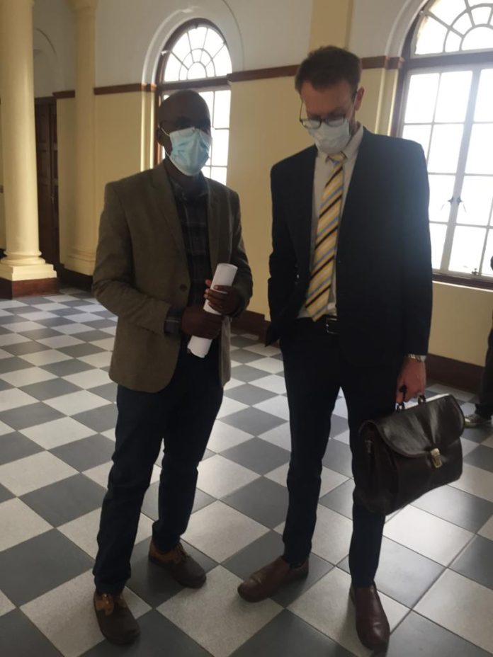 Jeffrey Moyo, left, and his lawyer Douglas Coltart