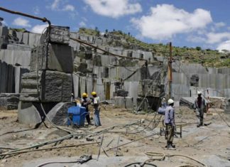 Miners at an open cast Granite mine in Mutoko