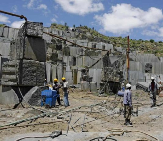 Miners at an open cast Granite mine in Mutoko