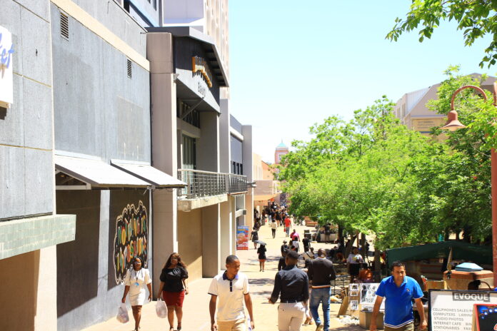 Lunch hour in Windhoek's Central Business District (CBD) with residents walking through Post Street Mall, Windhoek's main business center..