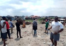 Picture of journalists and victims of forced evictions in Mosafejo-Oworonshoki